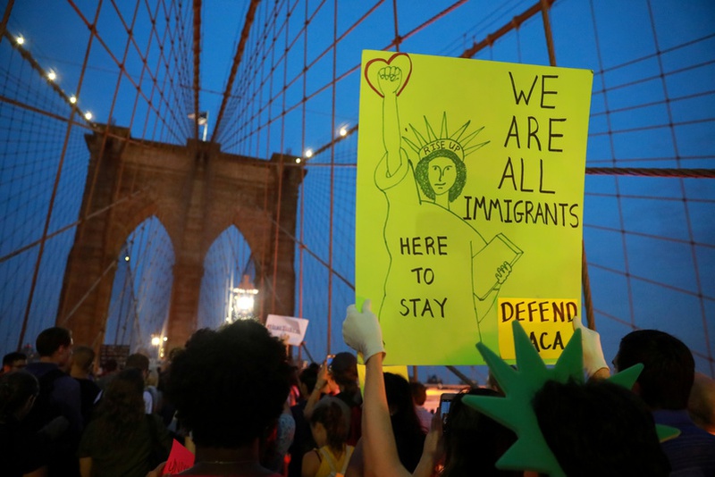 People march across the Brooklyn Bridge to protest the planned dissolution of DACA in Manhattan. REUTERS  Stephen Yang