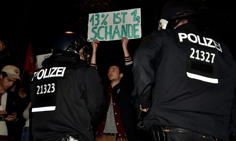 Protesters chanting'Nazis out hit AfD vote party