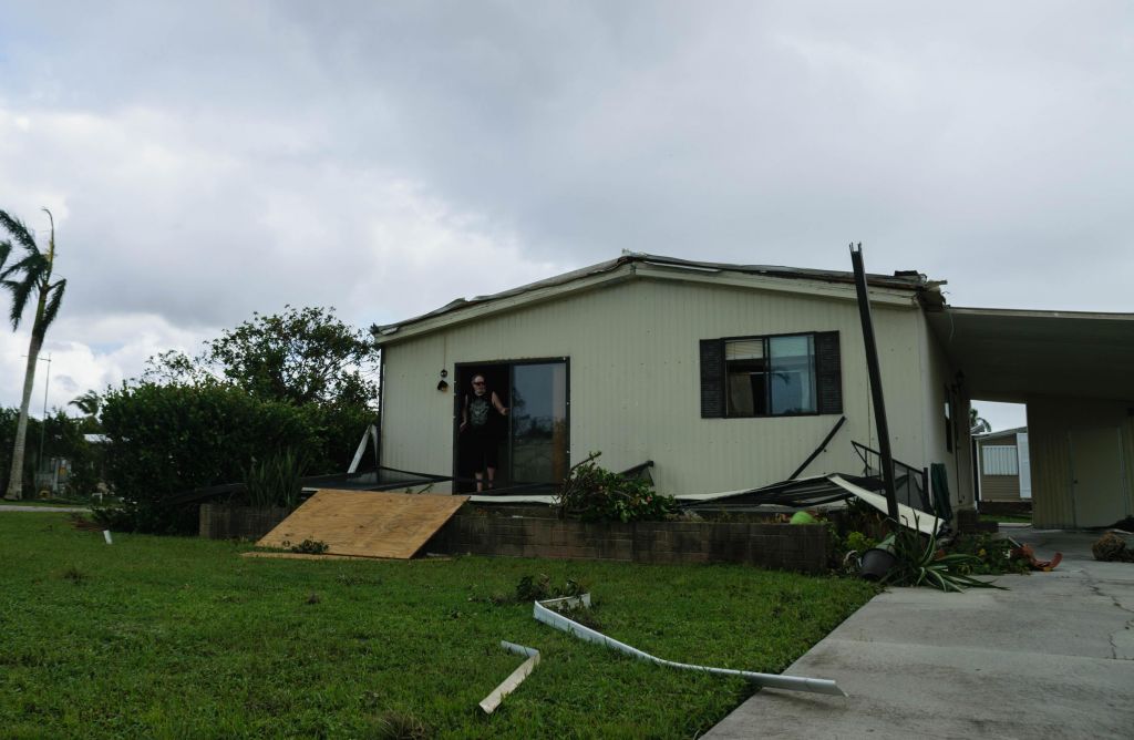 Robert Reed stands in the doorway of his manufactured home in Naples