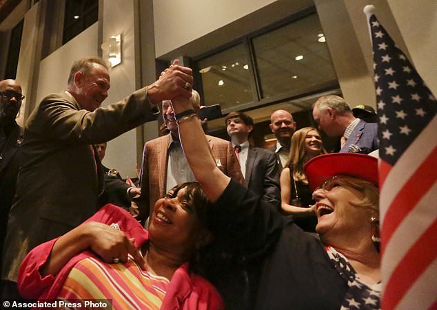 Former Alabama Chief Justice and U.S. Senate candidate Roy Moore greets supporter Patricia Jones right before his election party Tuesday Sept. 26 2017 in Montgomery Ala