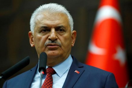 Binali Yildirim addresses members of parliament from his ruling AK Party during a meeting at the Turkish parliament in Ankara Turkey