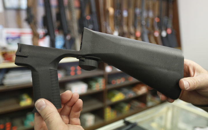 A bump stock device fits on a semi-automatic rifle to increase the firing speed