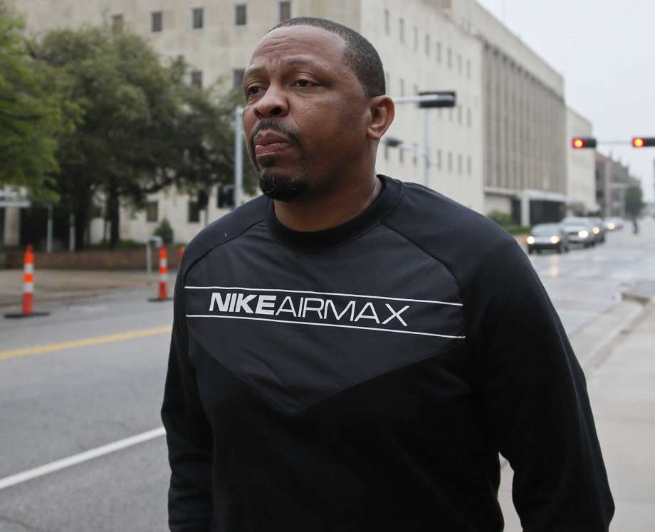 Lamont Evans an assistant basketball coach at Oklahoma State University leaves the federal courthouse following a court appearance in Oklahoma City Wednesday Sept. 27 2017. Evans is facing federal charges in conjunction with a wide probe of fraud and