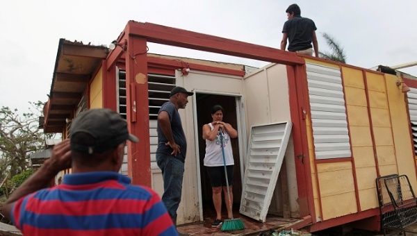 Residents clean their home after Hurricane Maria hit the island in September Toa Baja Oct. 18 2017