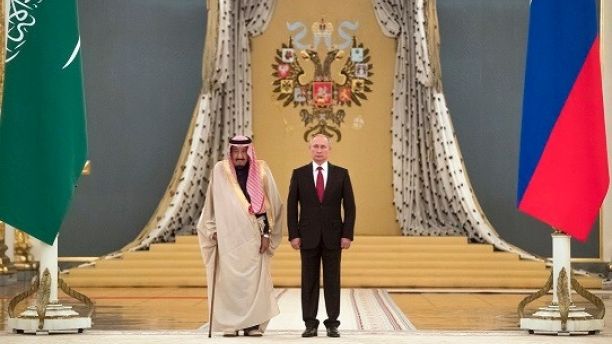 Russian President Vladimir Putin right and Saudi King Salman listen national anthems during their meeting in Kremlin Moscow Russia Thursday Oct. 5 2017. King Salman arrived in Moscow Wednesday on the first ever visit by a Saudi monarch to Russia