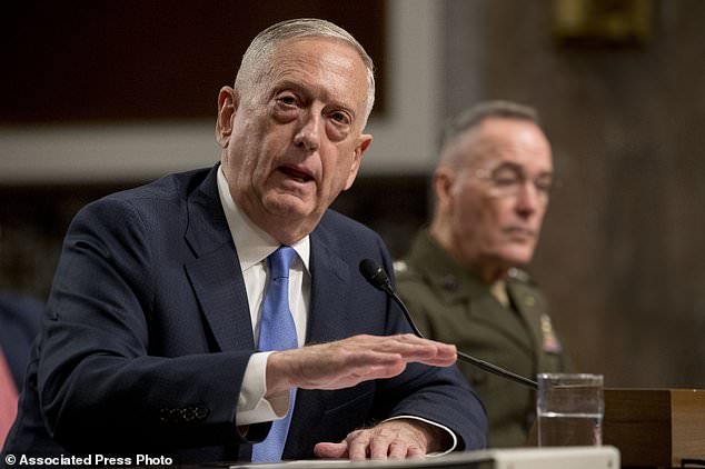 Defense Secretary Jim Mattis left accompanied by Joint Chiefs Chairman Gen. Joseph Dunford speaks on Afghanistan before the Senate Armed Services Committee on Capitol Hill in Washington Tuesday Oct. 3 2017