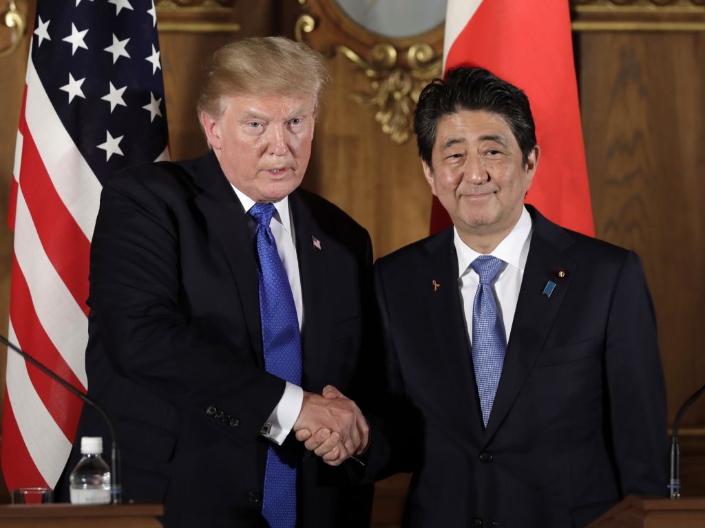 President Donald Trump shakes hands with Japanese Prime Minister Shinzo Abe during a joint news conference at the Akasaka Palace on Monday in Tokyo