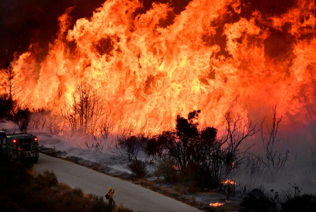 Firefighters forced to step aside as winds powered infernos