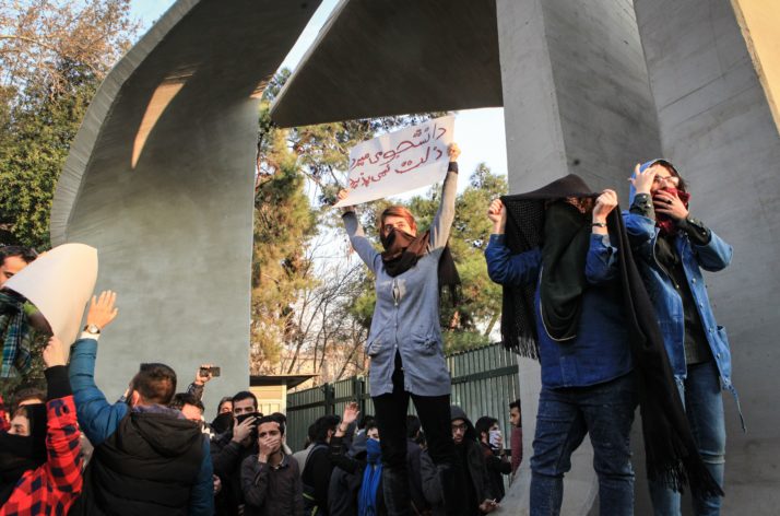 Iranian students protest at the University of Tehran during a demonstration | AFP via Getty Images