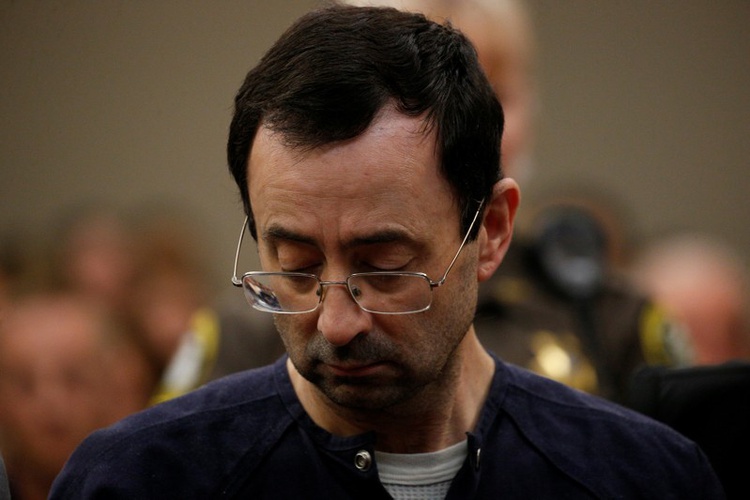 Larry Nassar a former team USA Gymnastics doctor who pleaded guilty in November 2017 to sexual assault charges listens as he is sentenced