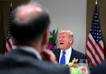 U.S. President Donald Trump attends a dinner with business men and CEO's during the World Economic Forum annual meeting in Davos Switzerland