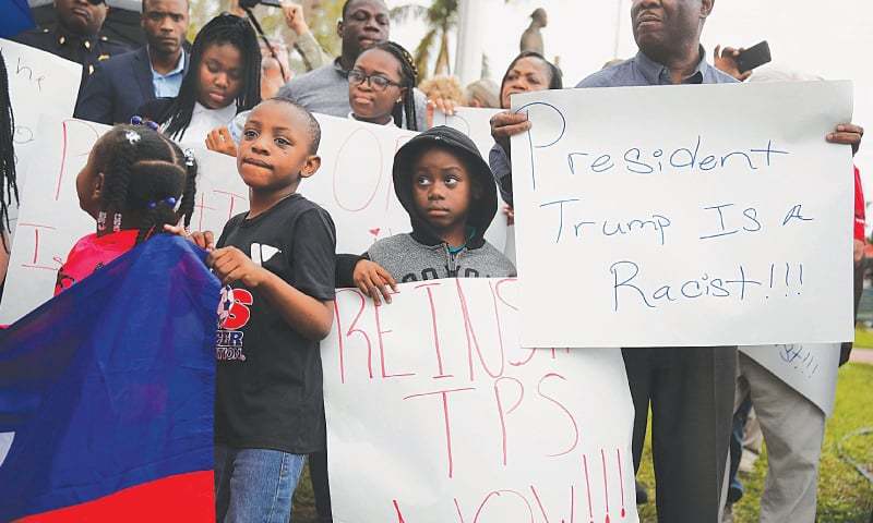 MIAMI: People join together to mark the 8th anniversary of the massive earthquake in Haiti and to condemn President Donald Trump’s reported statement about immigrants from Haiti Africa and El Salvador.—AFP