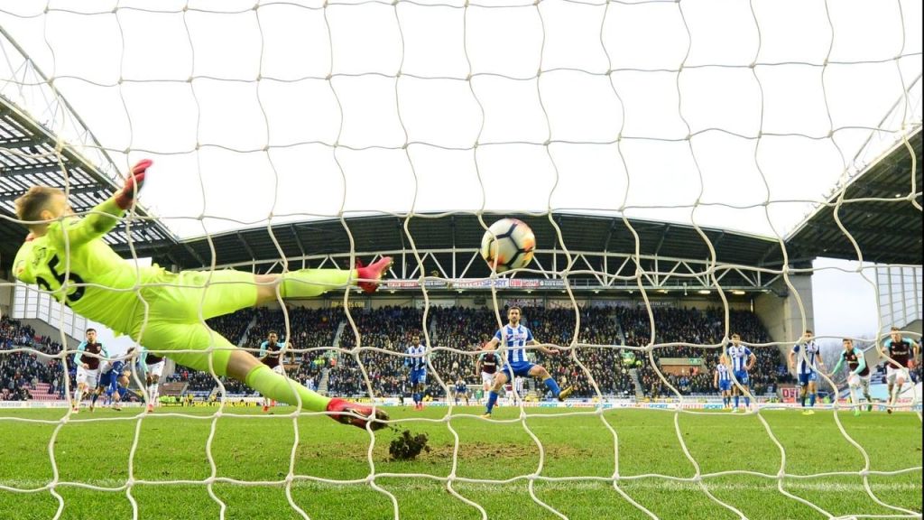 Will Grigg scores Wigan's second in the 2-0 FA Cup win over Premier League side West Ham