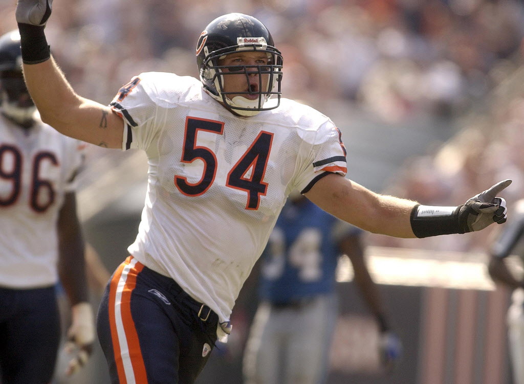 Bears linebacker Brian Urlacher celebrates after sacking Lions quarterback Joey Harrington in 2001