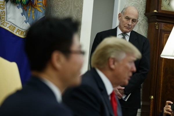 White House Chief of Staff John Kelly listens during a meeting between President Donald Trump and North Korean defectors in the Oval Office of the White House in Washington