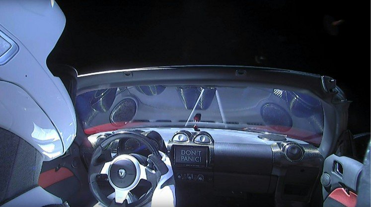 This still image taken from a SpaceX livestream video shows'Starman sitting in SpaceX CEO Elon Musk's cherry red Tesla roadster after the Falcon Heavy rocket delivered it into orbit around the Earth