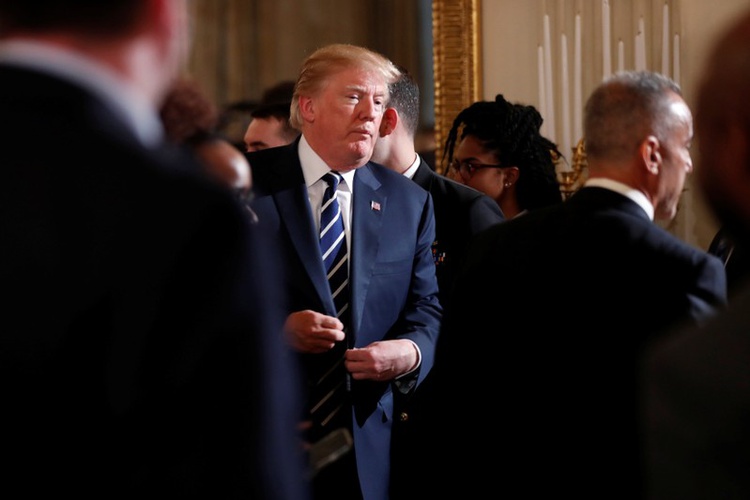 U.S. President Donald Trump departs after a listening session with Marjory Stoneman Douglas High School shooting survivors and students at