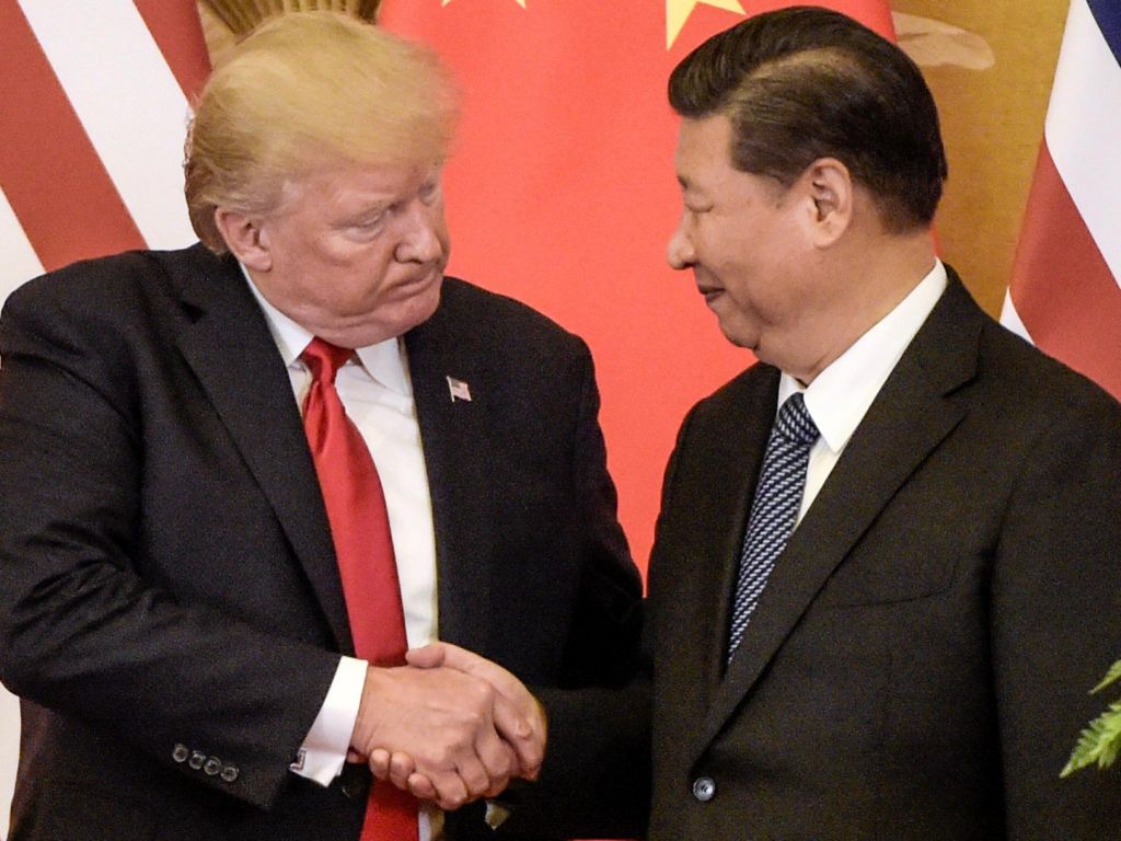 US President Donald Trump shaking hands with China's President Xi Jinping