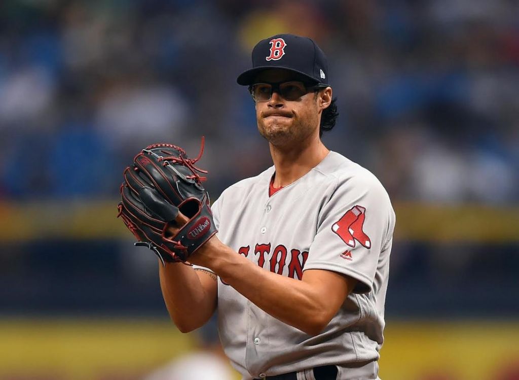 Joe Kelly grimmaces after the Tampa Bay Rays scored during the eighth inning of the game at Tropicana Field in St. Petersburg Florida on Thursday