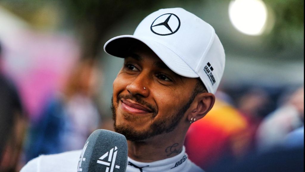 Lewis Hamilton is all smiles after qualifying in pole position for the Australian Grand Prix