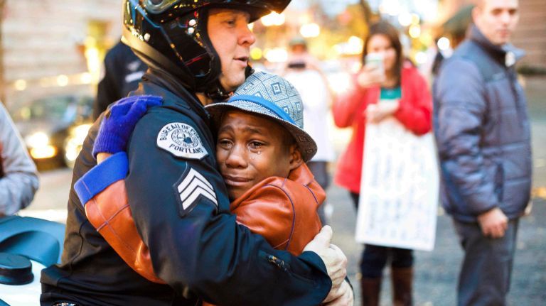 Portland police Sgt. Bret Barnum and Devonte Hart