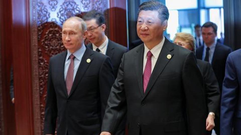 Russia's President Vladimir Putin with Chinese President Xi Jinping attends the Roundtable Summit Phase One Sessions of Belt and Road Forum at the International Conference Center in Yanqi Lake