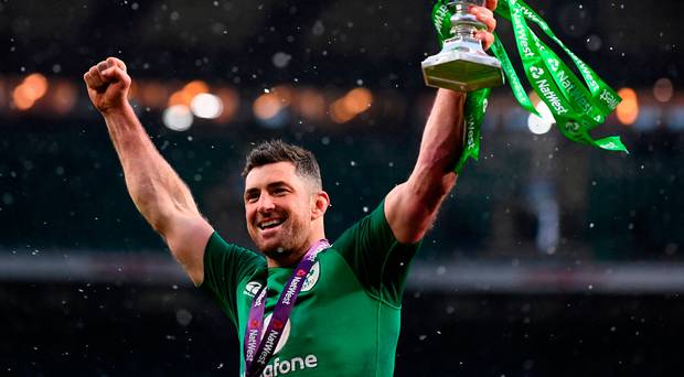 Rob Kearney celebrates with the Six Nations trophy after Ireland’s 24-15 victory over England at Twickenham yesterday