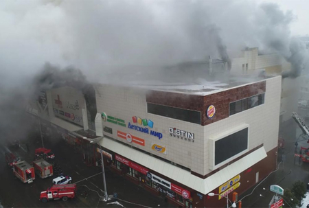 Four children and two adults die as Siberian shopping centre bursts into flames after a fire sparked in the children's area