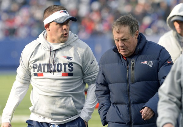 New England Patriots offensive coordinator Josh McDaniels left talks to head coach Bill Belichick at the end of the first half of an NFL football game against the Buffalo Bills Sunday Dec. 3 2017 in Orchard Park N.Y. The Patriots beat the Bills 23