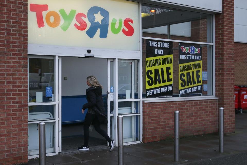 Closing down posters are seen in the windows of a Toys 'R&apos Us store in London. In the United States and overseas the retailer is struggling mightily