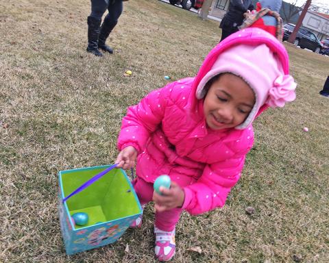 Sophie Folaju of Flossmoor starts her hunt for Easter eggs at Irwin Park on Saturday March 24