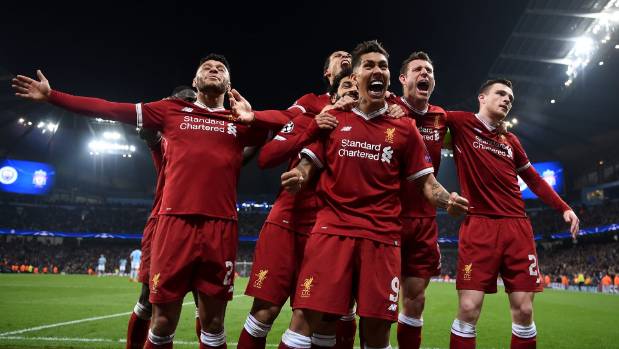 Liverpool players celebrate after Roberto Firmino scored the match-winner in their 2-1 victory over Manchester City