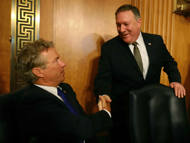 Secretary of State nominee Mike Pompeo, greets Sen. Rand Paul, during his confirmation hearing before a Senate Foreign Relations Committee on Capitol Hill