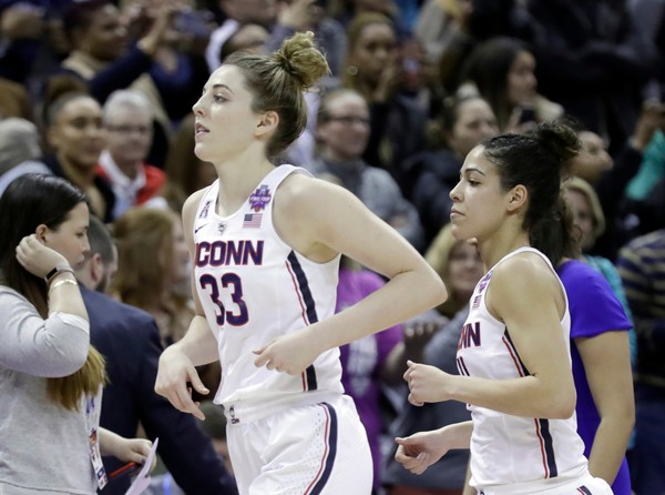 Connecticut's Katie Lou Samuelson and Kia Nurse run off the court after a 91-89 overtime loss to Notre Dame in the semifinals of the women's NCAA Final Four college basketball tournament Friday