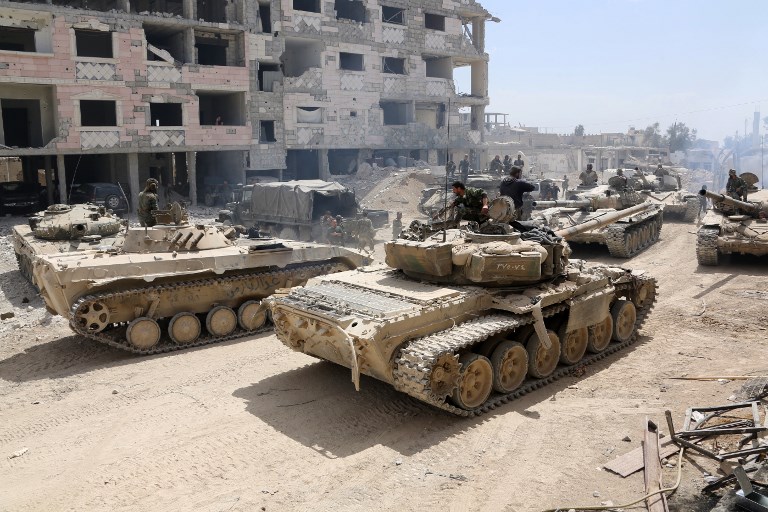 8 2018 shows Syrian Army soldiers gathering in an area on the eastern outskirts of Douma as they continue their fierce offensive to retake the last opposition holdout in Eastern Ghouta