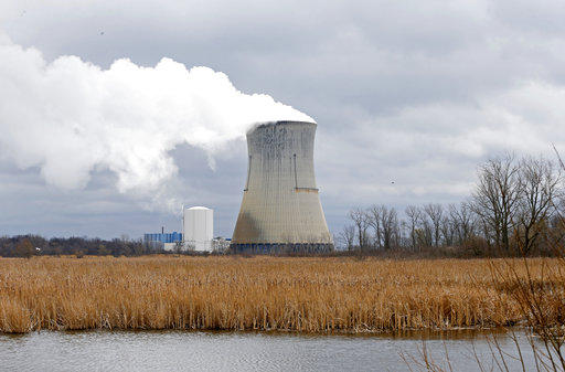 Plumes of steam drift from the cooling tower of First Energy Corp.'s Davis Besse Nuclear Power Station in Oak Harbor Ohio