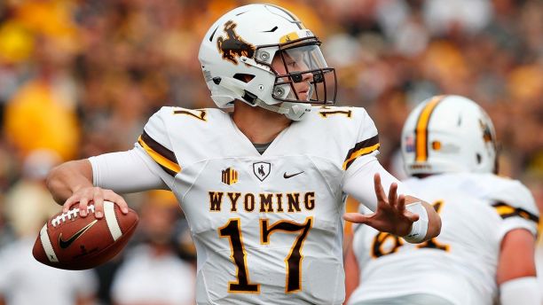 Wyoming quarterback Josh Allen throws a pass during the first half of an NCAA college football game against Iowa in Iowa City Iowa. Four quarterbacks are certain to go in the first round of the NFL draft. (AP Ph