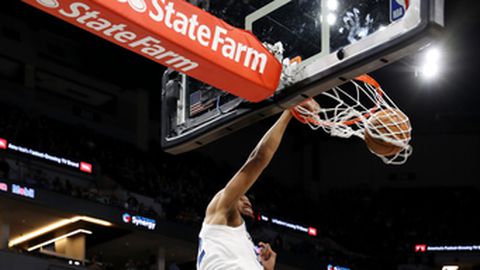 MINNEAPOLIS MN- APRIL 9 Karl Anthony Towns #32 of the Minnesota Timberwolves dunks the ball during the game against the Memphis Grizzlies