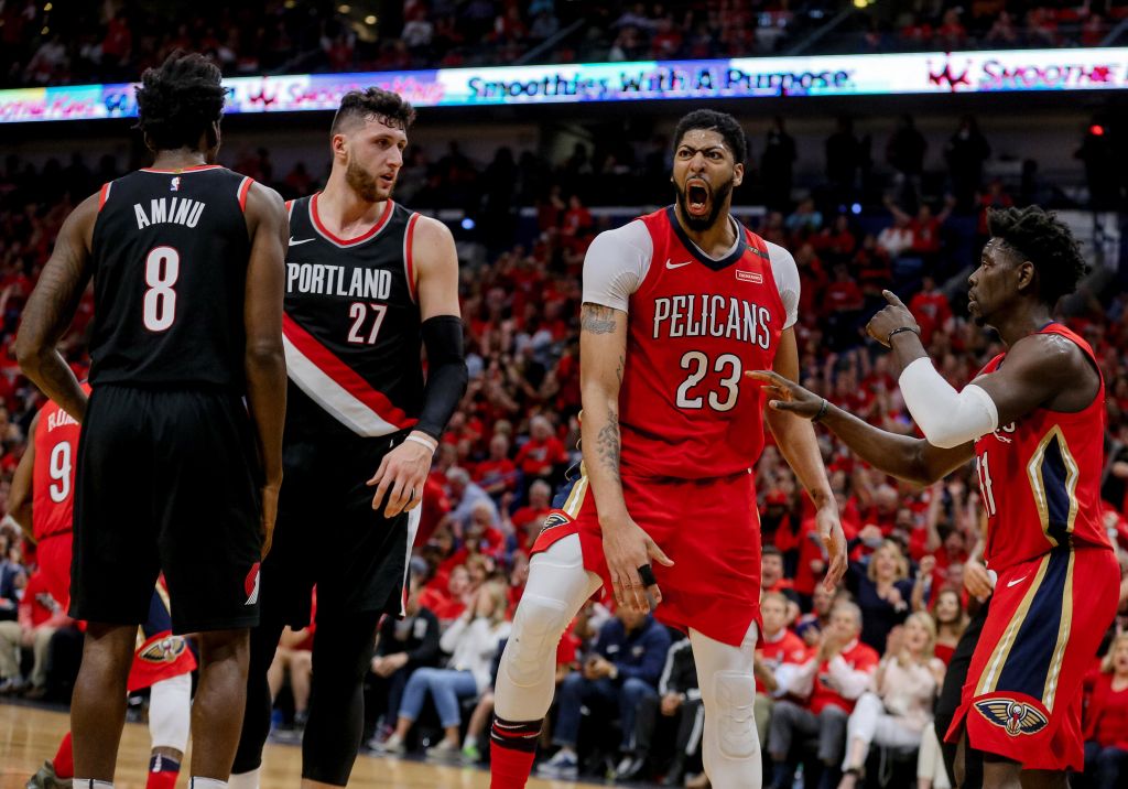 Apr 21 2018 New Orleans LA USA New Orleans Pelicans forward Anthony Davis reacts after dunking against Portland Trail Blazers center Jusuf Nurkic and forward Al Farouq Aminu during the fourth quarter in game four of the first round of