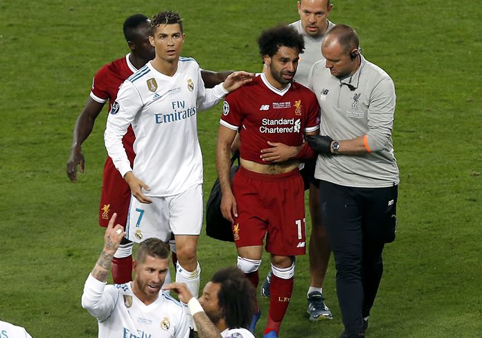 Liverpool's Mohamed Salah 2nd right leaves the pitch during the Champions League Final against Real Madrid at the Olimpiyskiy Stadium in Kiev Ukraine Saturday May 26