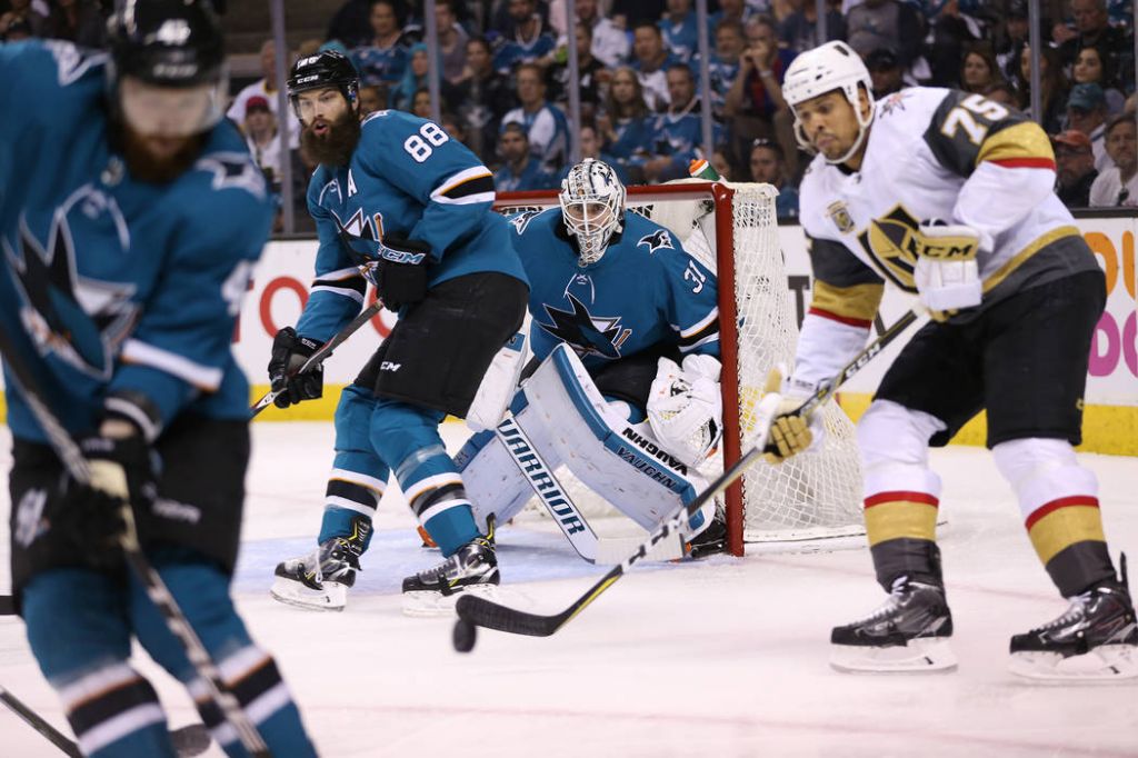 San Jose Sharks goaltender Martin Jones and defenseman Brent Burns defend against Vegas Golden Knights right wing Ryan Reaves during the first period in Game 6 of an NHL hockey seco