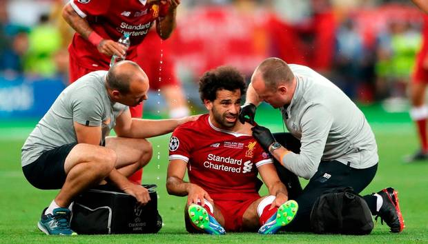 Liverpool's Mohamed Salah reacts after picking up an injury during the UEFA Champions League Final