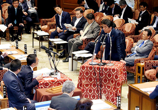 Prime Minister Shinzo Abe right fields questions in the Lower House Budget Committee on May 14