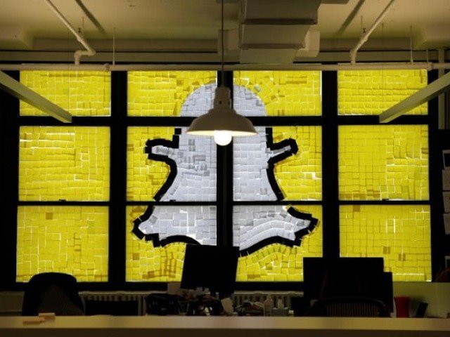 An image of the Snapchat logo created with Post-it notes is seen in the windows of Havas Worldwide at 200 Hudson Street in lower Manhattan New York U.S