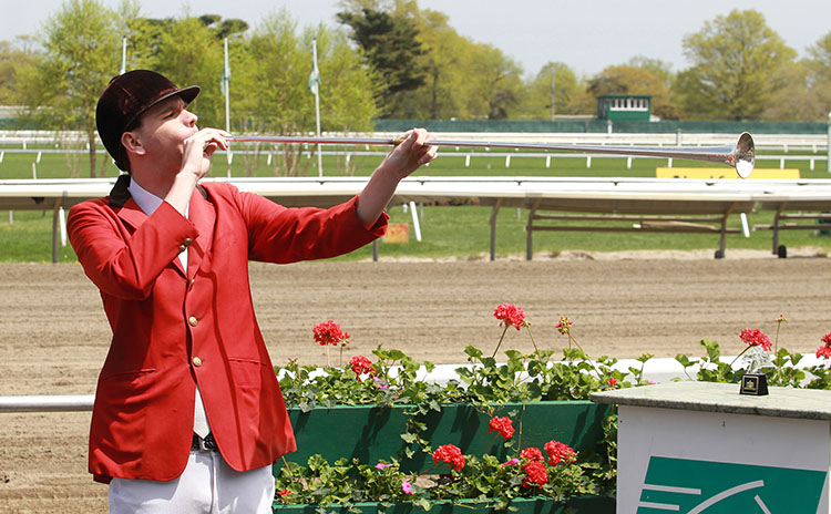 The Monmouth Park bugler announces the races are set to begin