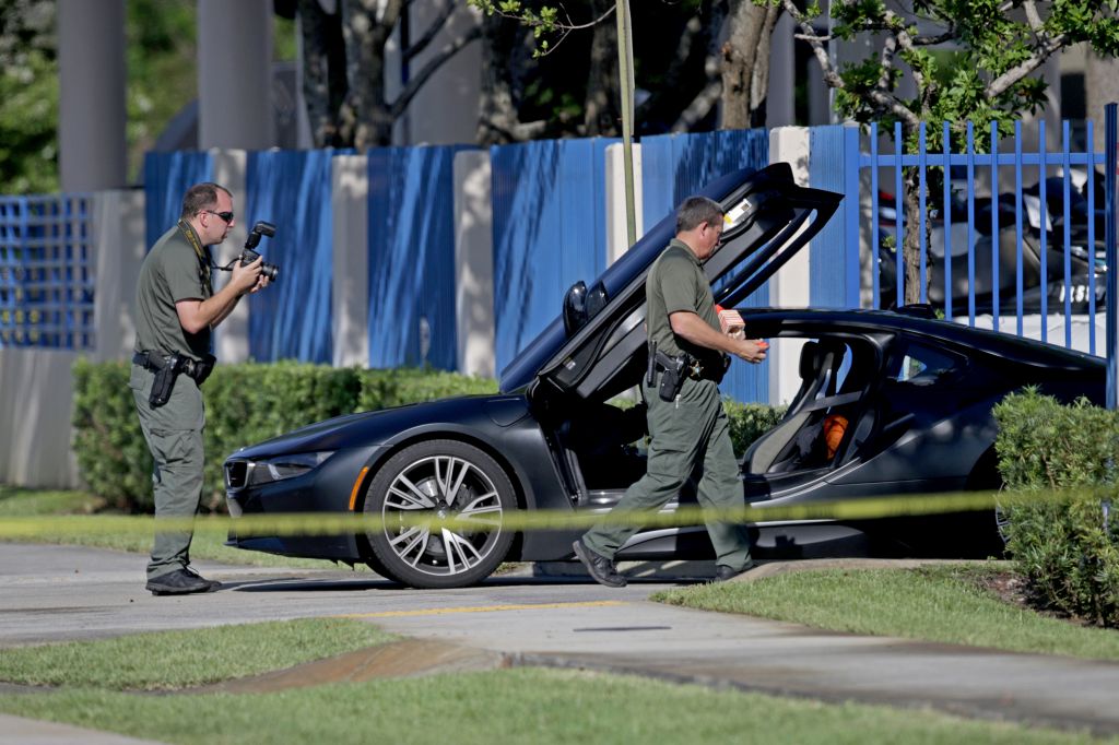 A BMW sits idle after reports of a shooting in Deerfield Beach Fla. involving rapper XXXTentacion