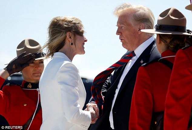 After landing in Quebec Canada on Friday Trump greeted US Ambassador to Canada Kelly Craft with a hilariously awkward kiss