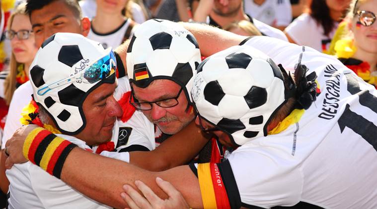 Germany fans react after the match at a public viewing area at Brandenburg Gate