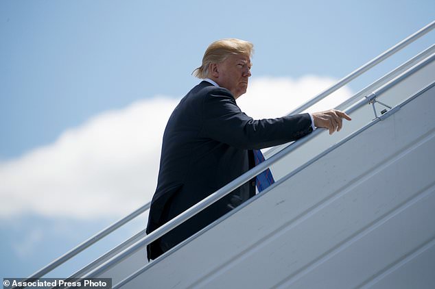 President Donald Trump boards Air Force One for a trip to Singapore to meet with North Korean leader Kim Jong Un Saturday