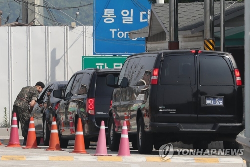 Vehicles carrying a U.S. negotiation team led by Sung Kim U.S. ambassador to the Philippines and former nuclear envoy head toward the inter Korean border village of Panmunjom